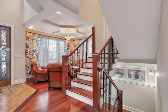 8453 W Bruce Dr, Niles, IL 60714 - entrance foyer with a chandelier, wood finished floors, plenty of natural light, stairs, and coffered ceiling