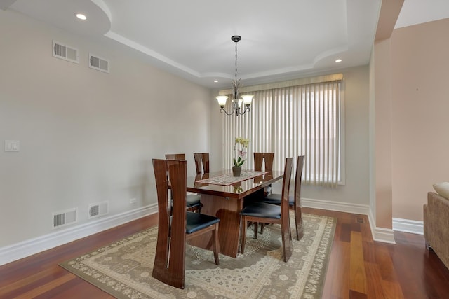 8453 W Bruce Dr, Niles, IL 60714 - dining area with a tray ceiling, a chandelier, wood finished floors, and recessed lighting