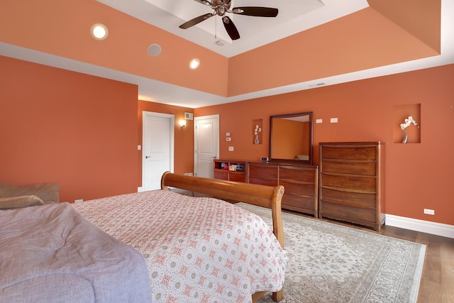 8453 W Bruce Dr, Niles, IL 60714 - bedroom with a raised ceiling, wood finished floors, recessed lighting, and ceiling fan