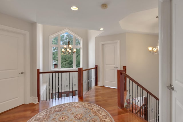 8453 W Bruce Dr, Niles, IL 60714 - hall featuring a chandelier, an upstairs landing, wood finished floors, and recessed lighting