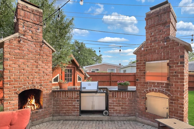 8453 W Bruce Dr, Niles, IL 60714 - view of patio featuring an outdoor brick fireplace and an outdoor kitchen