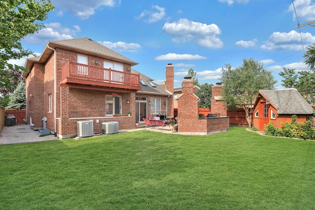 8453 W Bruce Dr, Niles, IL 60714 - back of property featuring a balcony, a patio, brick siding, a fenced backyard, and a shed