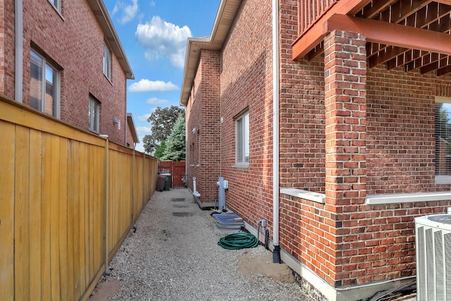 8453 W Bruce Dr, Niles, IL 60714 - view of side of home with brick siding and a central air condition unit