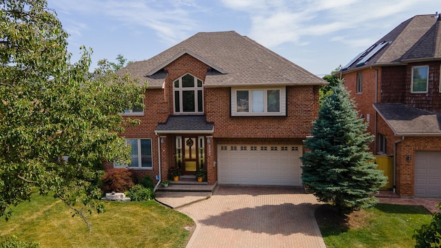 8453 W Bruce Dr, Niles, IL 60714 - view of front of house featuring decorative driveway, an attached garage, brick siding, a shingled roof, and a front lawn