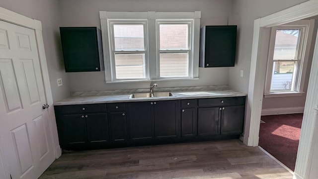 8817 S Elizabeth St, Chicago, IL 60620 - kitchen featuring light wood finished floors, light countertops, and dark cabinets