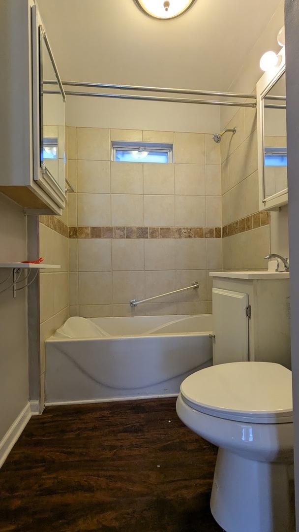 8817 S Elizabeth St, Chicago, IL 60620 - full bath with wood finished floors,  shower combination, and vanity