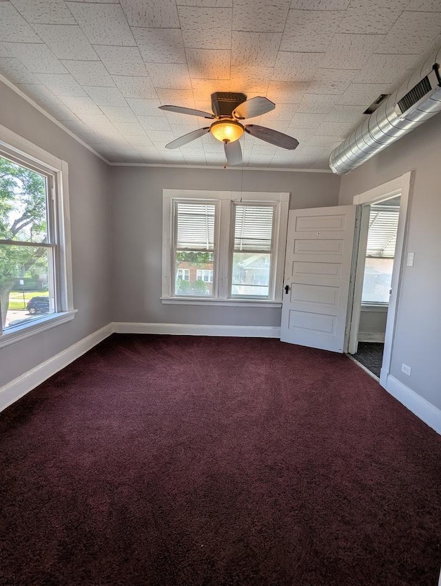 8817 S Elizabeth St, Chicago, IL 60620 - spare room with dark colored carpet, a ceiling fan, and crown molding