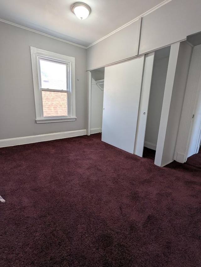 8817 S Elizabeth St, Chicago, IL 60620 - unfurnished bedroom with crown molding, carpet, and a closet