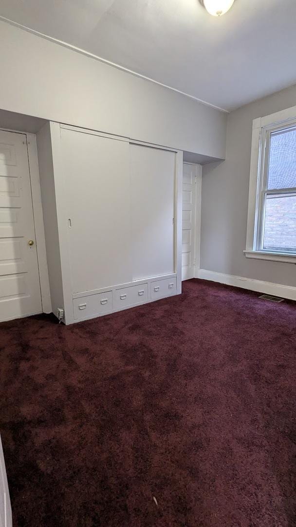 8817 S Elizabeth St, Chicago, IL 60620 - spare room with dark colored carpet