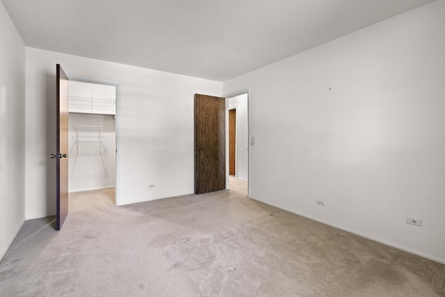 543 Williamsburg Ct Unit C2, Wheeling, IL 60090 - unfurnished bedroom with carpet floors and a walk in closet