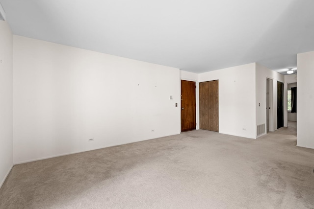 543 Williamsburg Ct Unit C2, Wheeling, IL 60090 - unfurnished room with light colored carpet