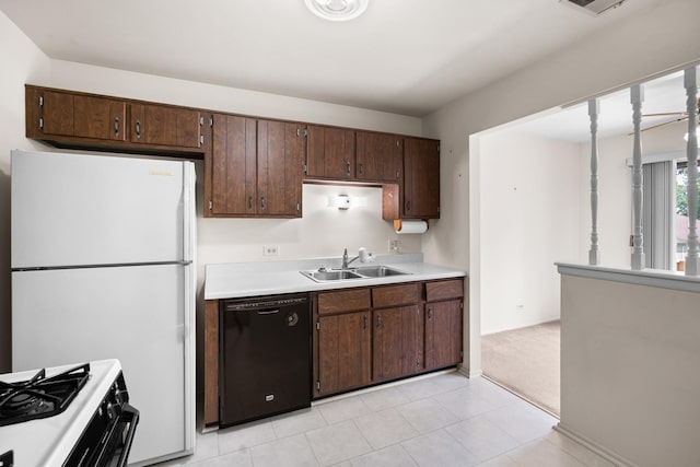 543 Williamsburg Ct Unit C2, Wheeling, IL 60090 - kitchen featuring black dishwasher, range with gas cooktop, light countertops, dark brown cabinetry, and freestanding refrigerator