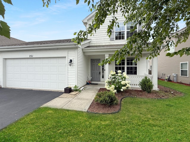 251 Maryland Ln, Pingree Grove, IL 60140 - view of front facade with driveway, a garage, a front yard, and a porch