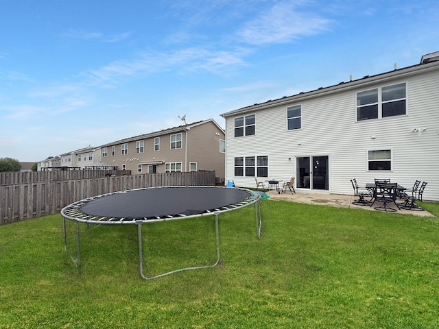 251 Maryland Ln, Pingree Grove, IL 60140 - rear view of house with a trampoline and a patio area