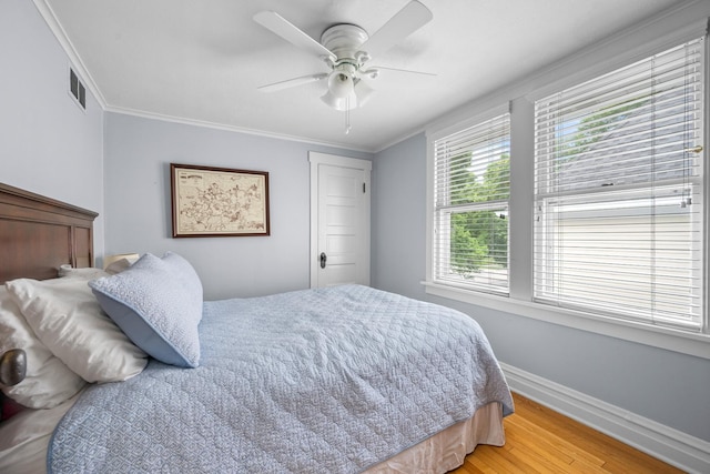 1718 Lake Ave, Wilmette, IL 60091 - bedroom with light wood finished floors, ornamental molding, and ceiling fan