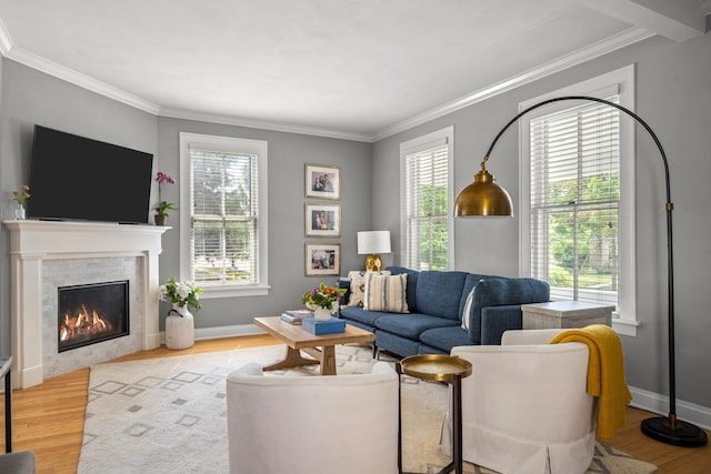 1718 Lake Ave, Wilmette, IL 60091 - living area with crown molding, wood finished floors, healthy amount of natural light, and a fireplace