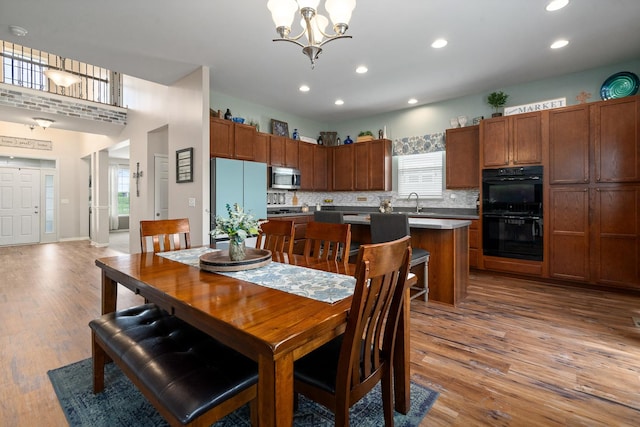 8102 Expedition St, Joliet, IL 60431 - dining room featuring light wood-style floors, recessed lighting, and a chandelier