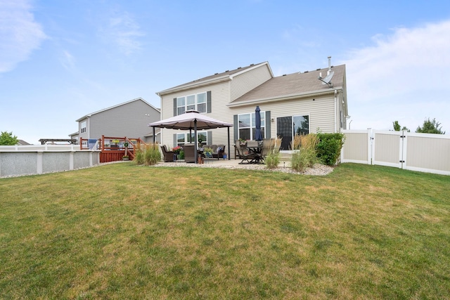 8102 Expedition St, Joliet, IL 60431 - back of property with a gate, a patio area, and outdoor lounge area