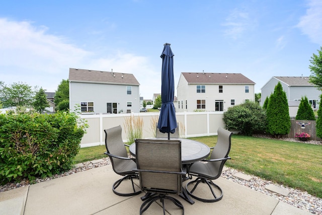 8102 Expedition St, Joliet, IL 60431 - fenced backyard with a patio, outdoor dining area, and a residential view