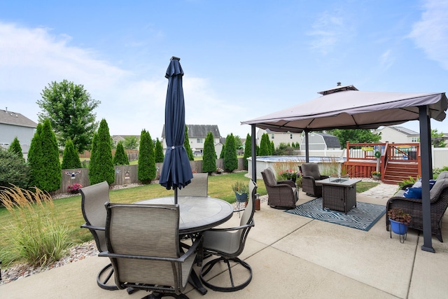 8102 Expedition St, Joliet, IL 60431 - fenced backyard with a gazebo, a patio area, outdoor dining area, a deck, and an outdoor living space with a fire pit