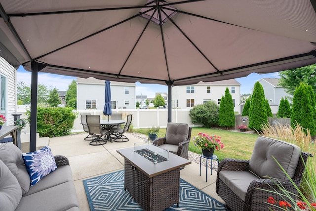 8102 Expedition St, Joliet, IL 60431 - fenced backyard featuring an outdoor living space with a fire pit, a patio, outdoor dining space, and a gazebo
