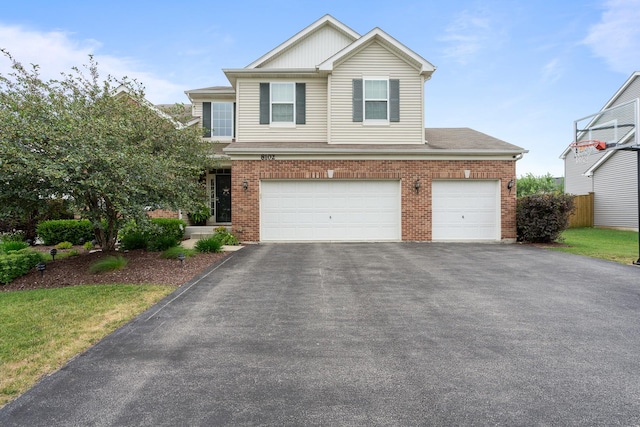 8102 Expedition St, Joliet, IL 60431 - traditional-style house featuring brick siding, asphalt driveway, and a garage