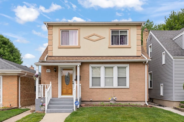 3812 N Pioneer Ave, Chicago, IL 60634 - view of front of house with a front yard and brick siding