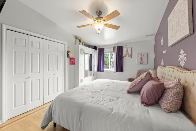 3812 N Pioneer Ave, Chicago, IL 60634 - bedroom with a closet, light wood-style flooring, and a ceiling fan