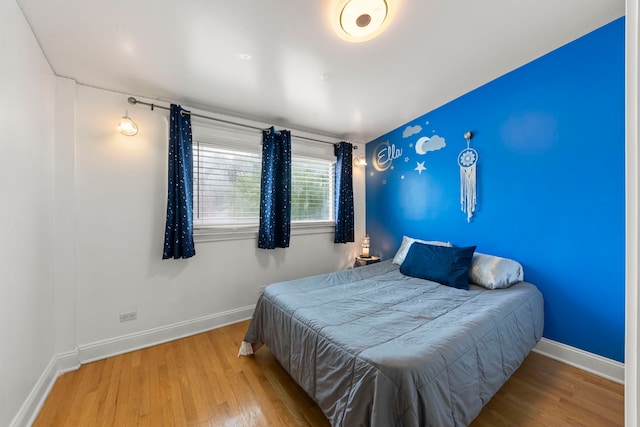 3812 N Pioneer Ave, Chicago, IL 60634 - bedroom with wood finished floors and baseboards