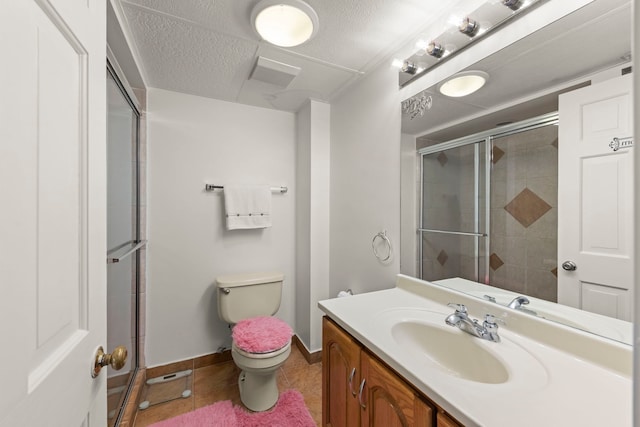 3812 N Pioneer Ave, Chicago, IL 60634 - full bath featuring a shower with shower door, vanity, tile patterned flooring, and a textured ceiling