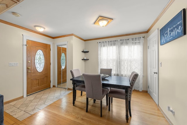 3812 N Pioneer Ave, Chicago, IL 60634 - dining space with light wood finished floors and ornamental molding