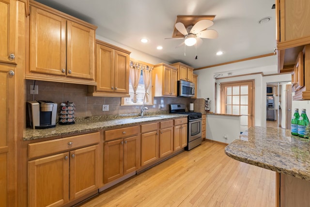 3812 N Pioneer Ave, Chicago, IL 60634 - kitchen featuring stainless steel appliances, ceiling fan, backsplash, light wood finished floors, and recessed lighting