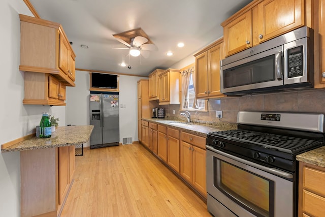 3812 N Pioneer Ave, Chicago, IL 60634 - kitchen featuring stainless steel appliances, light wood-type flooring, ceiling fan, backsplash, and recessed lighting