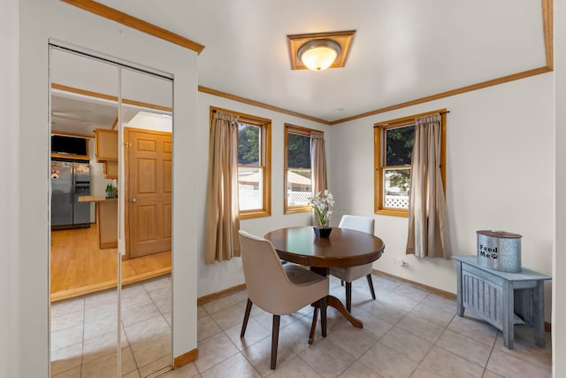 3812 N Pioneer Ave, Chicago, IL 60634 - dining area featuring crown molding and light tile patterned floors
