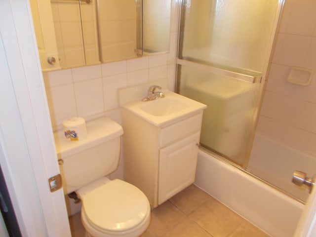 10811 S Lloyd Dr Unit 2, Worth, IL 60482 - bathroom featuring vanity, shower / bath combination with glass door, and tile patterned floors