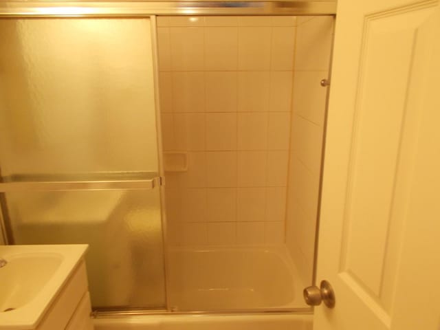 10811 S Lloyd Dr Unit 2, Worth, IL 60482 - full bath featuring vanity and combined bath / shower with glass door