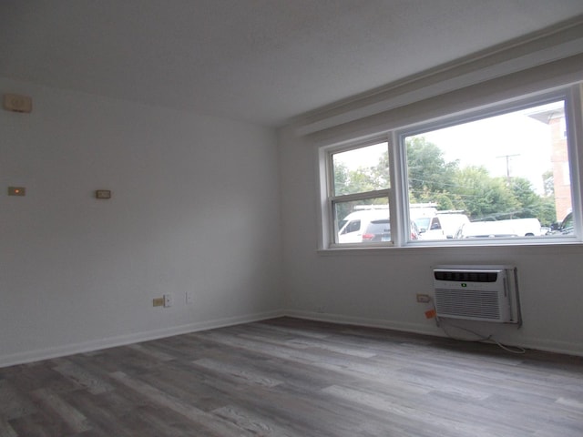 10811 S Lloyd Dr Unit 2, Worth, IL 60482 - empty room with wood finished floors and a wall mounted AC