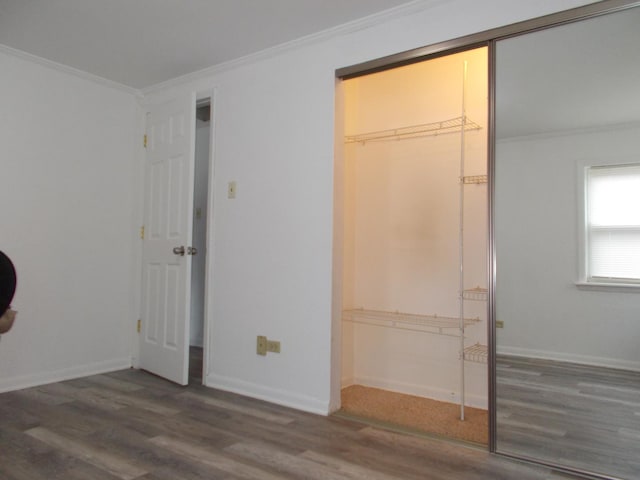 10811 S Lloyd Dr Unit 2, Worth, IL 60482 - unfurnished bedroom with crown molding, wood finished floors, and a closet