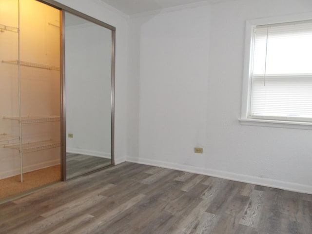10811 S Lloyd Dr Unit 2, Worth, IL 60482 - unfurnished bedroom featuring wood finished floors and a closet