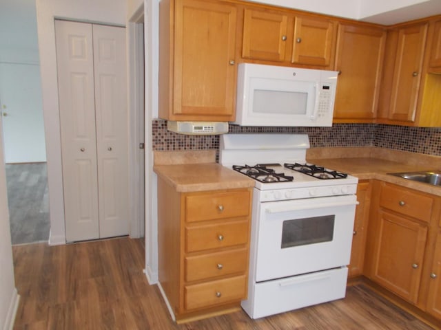 10811 S Lloyd Dr Unit 2, Worth, IL 60482 - kitchen with white appliances, light countertops, dark wood-style floors, and backsplash