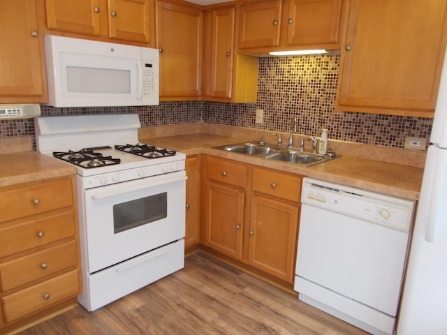 10811 S Lloyd Dr Unit 2, Worth, IL 60482 - kitchen featuring white appliances, backsplash, light countertops, and light wood-type flooring