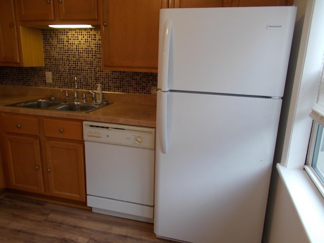 10811 S Lloyd Dr Unit 2, Worth, IL 60482 - kitchen with white appliances, wood finished floors, light countertops, backsplash, and brown cabinets