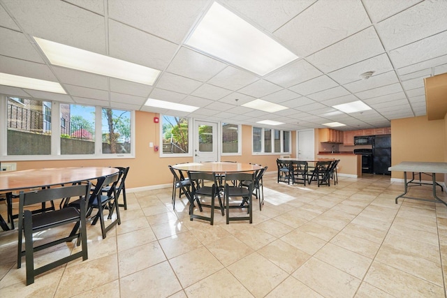 2021 S Wolf Rd Unit 2-118, Hillside, IL 60162 - dining room featuring light tile patterned floors and a drop ceiling