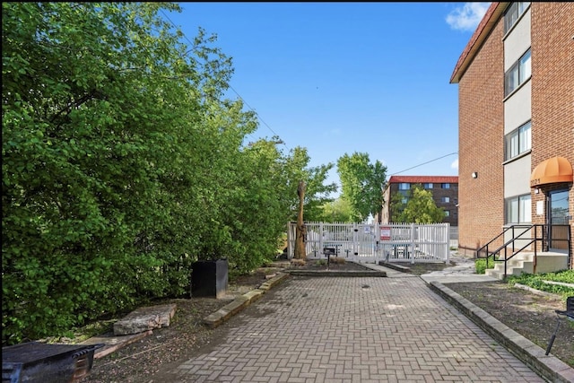 2021 S Wolf Rd Unit 2-118, Hillside, IL 60162 - view of patio featuring a gate