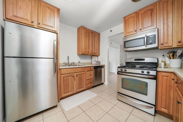 2021 S Wolf Rd Unit 2-118, Hillside, IL 60162 - kitchen featuring stainless steel appliances, light countertops, light tile patterned flooring, and brown cabinets