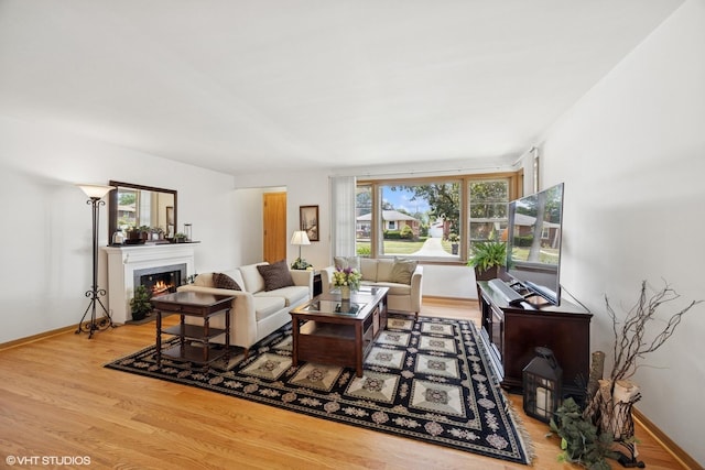 1865 Sunnyside Ave, Westchester, IL 60154 - living room with wood finished floors and a warm lit fireplace