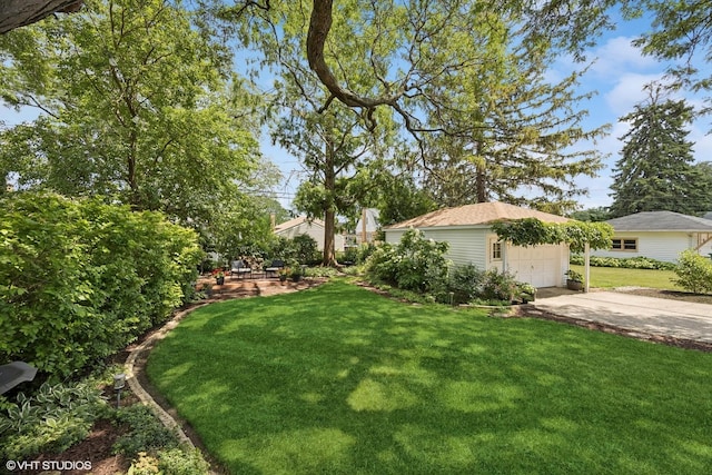 1865 Sunnyside Ave, Westchester, IL 60154 - view of green lawn featuring concrete driveway and an outdoor structure