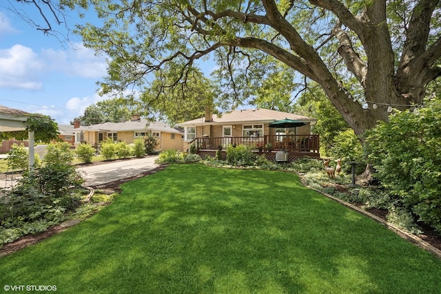 1865 Sunnyside Ave, Westchester, IL 60154 - view of grassy yard with a wooden deck and concrete driveway