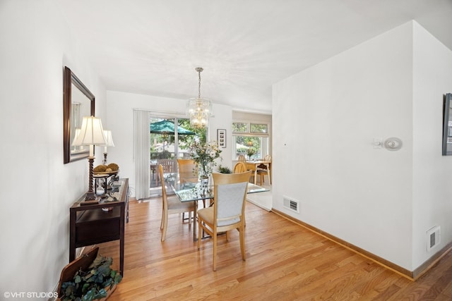 1865 Sunnyside Ave, Westchester, IL 60154 - dining space with a chandelier and light wood-style floors