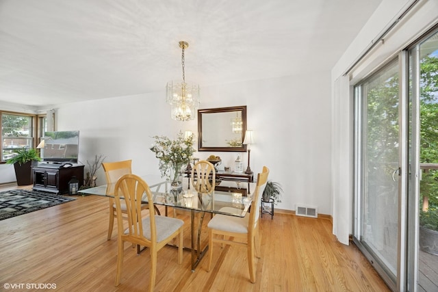 1865 Sunnyside Ave, Westchester, IL 60154 - dining area with wood finished floors and a chandelier